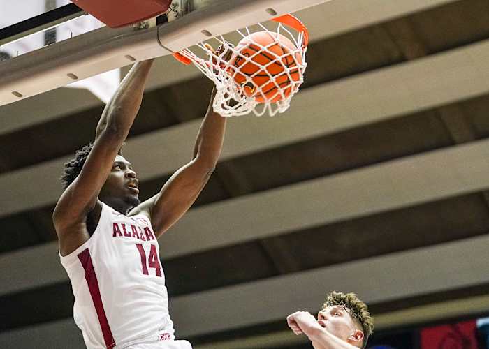 Alabama Crimson Tide center Charles Bediako (14) dunks the ball against the Vanderbilt Commodores during the second half at Coleman Coliseum.